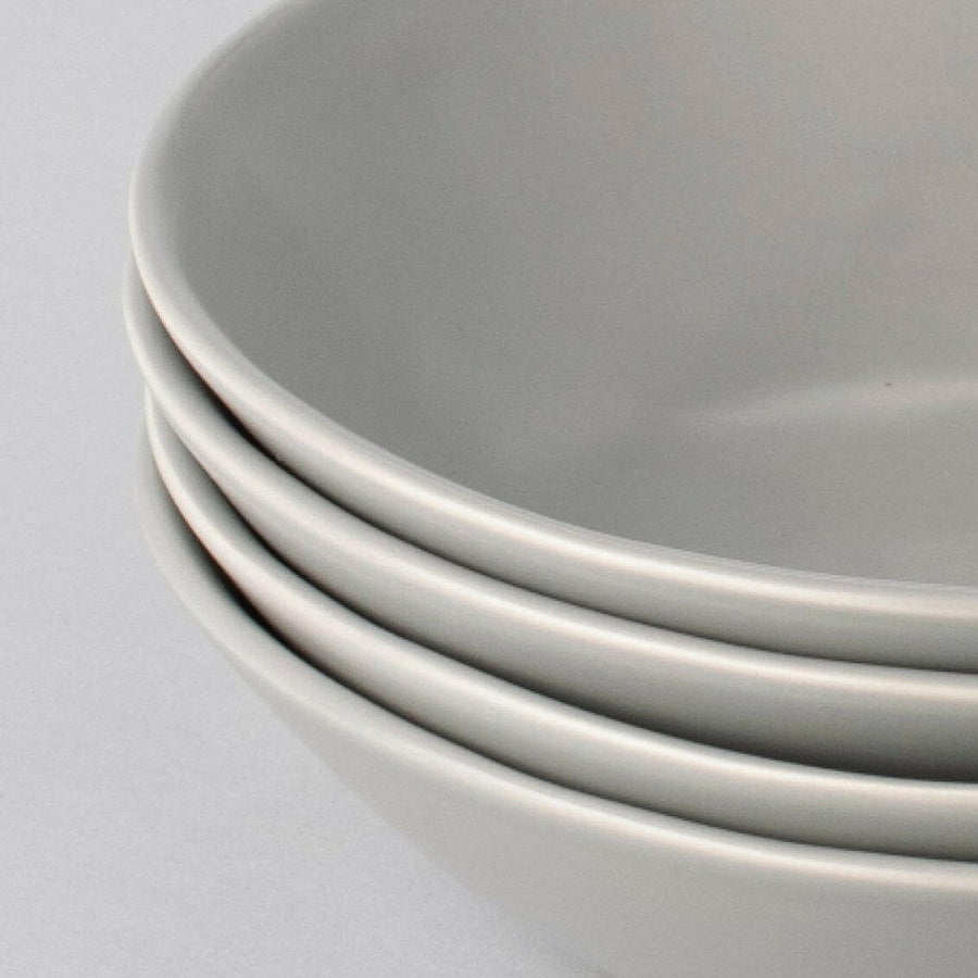 Elegant white porcelain dinnerware set featuring plates and bowls, perfect for formal dining occasions