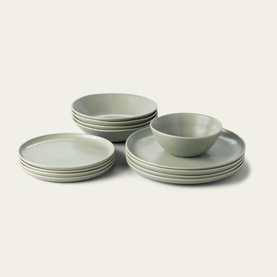 Elegant white porcelain dinnerware set featuring plates and bowls, perfect for formal dining occasions