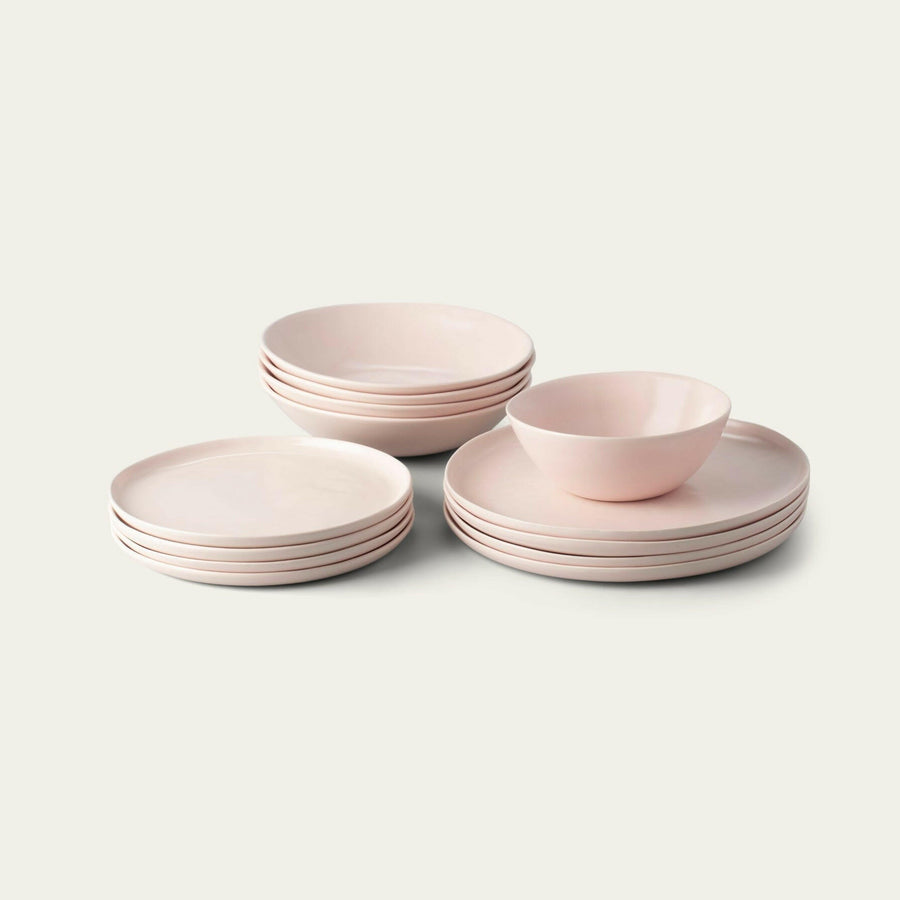 Elegant white porcelain dinnerware set featuring plates and bowls, perfect for formal dining occasions