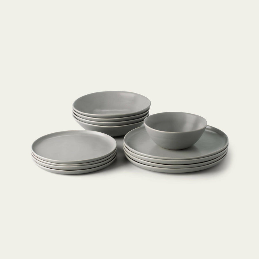 Elegant white porcelain dinnerware set featuring plates and bowls, perfect for formal dining occasions