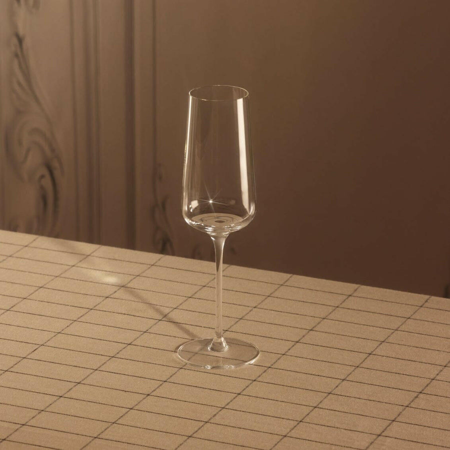 Elegant flute glasses arranged for a formal event, showcasing crystal-clear clarity and refined design