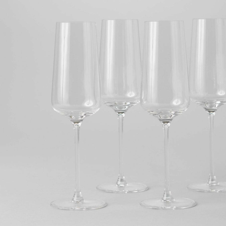 Elegant flute glasses arranged for a formal event, showcasing crystal-clear clarity and refined design