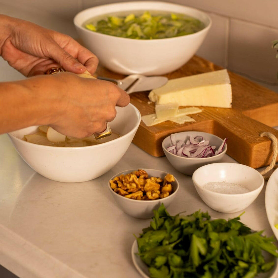 Elegant little bowls displayed on a wooden table, perfect for serving appetizers or desserts in style.
