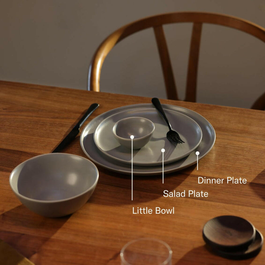Elegant little bowls displayed on a wooden table, perfect for serving appetizers or desserts in style.