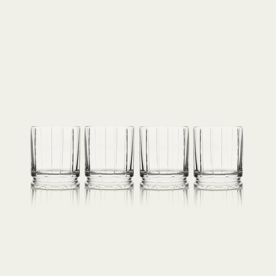 Stylish glasses resting on a bed of natural rocks, highlighting rugged elegance and clarity