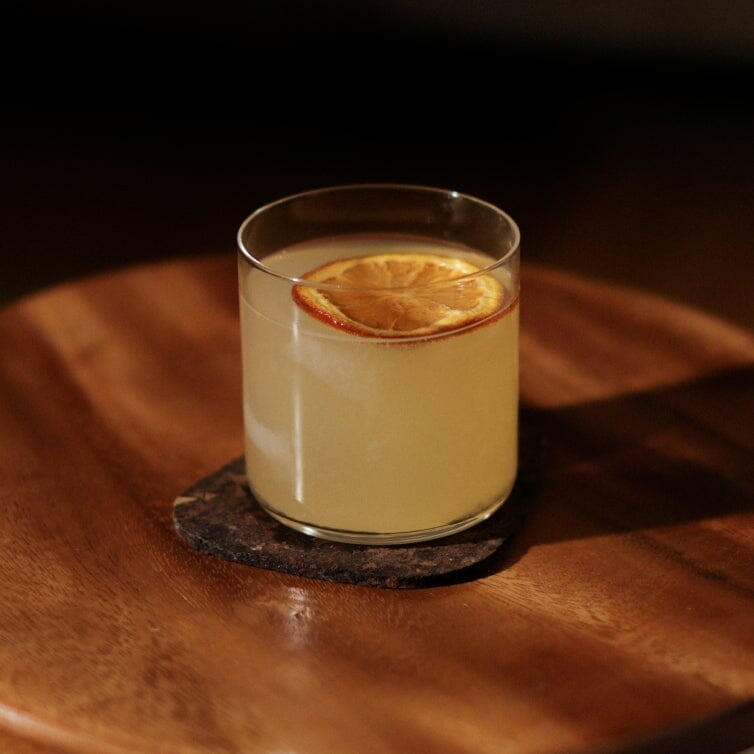 Elegant short hairstyle complemented by stylish glasses, showcasing a sophisticated and modern look for professional settings.