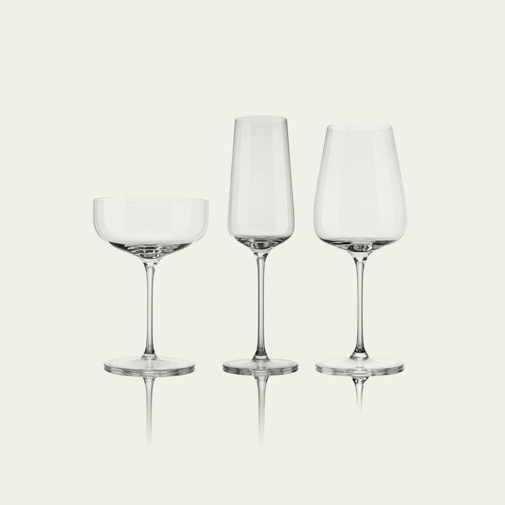 Elegant stemware set displayed on a polished wooden table, perfect for formal dining occasions and gatherings.