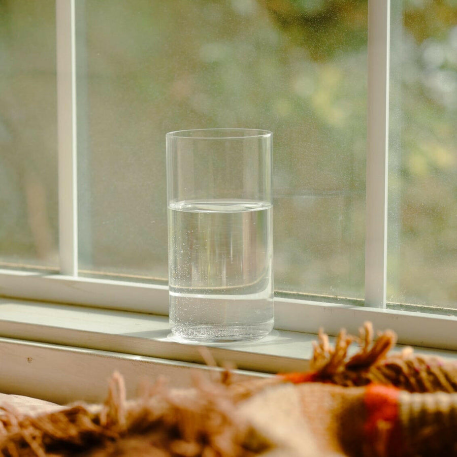 Tall person wearing stylish glasses, showcasing elegance and fashion in eyewear accessories.