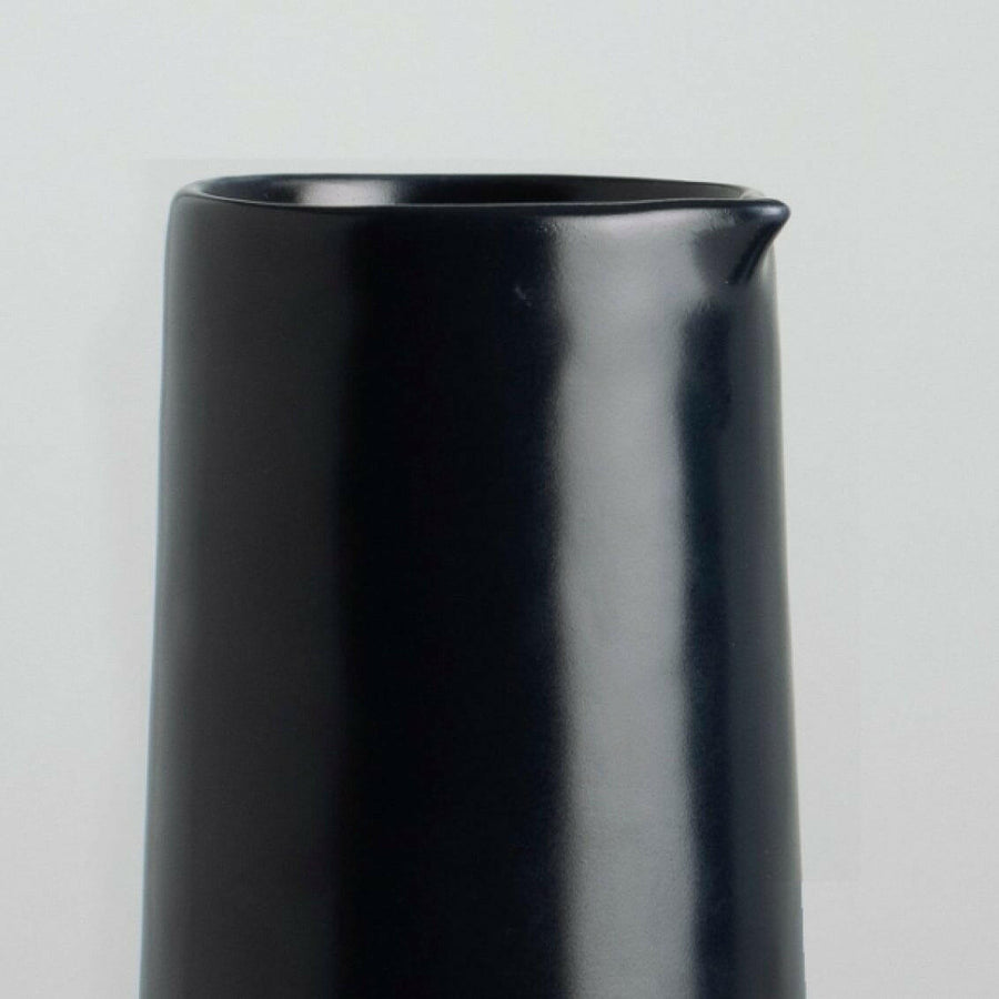 Elegant glass carafe filled with fresh water, perfect for dining table settings and enhancing beverage presentation