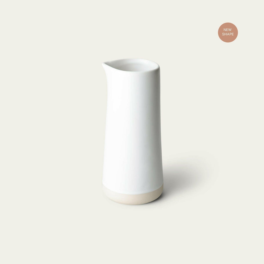 Elegant glass carafe filled with fresh water, perfect for dining table settings and enhancing beverage presentation