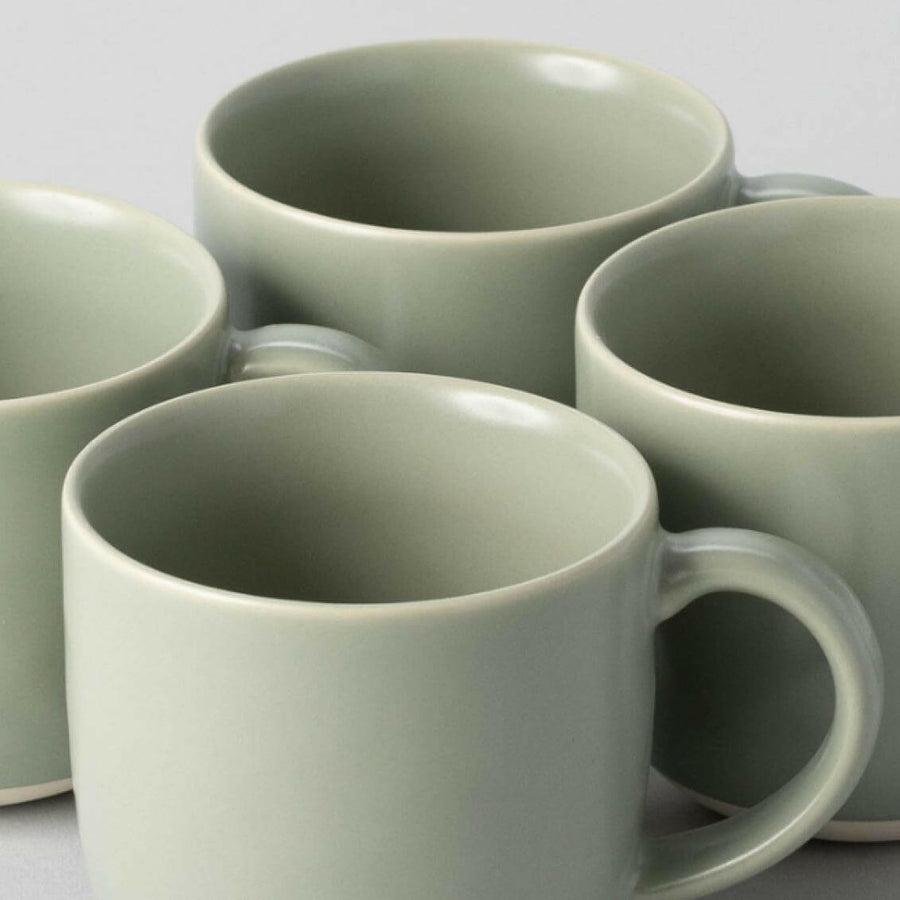 Elegant ceramic mugs perfect for hot beverages, ideal for office and home use with stylish design.