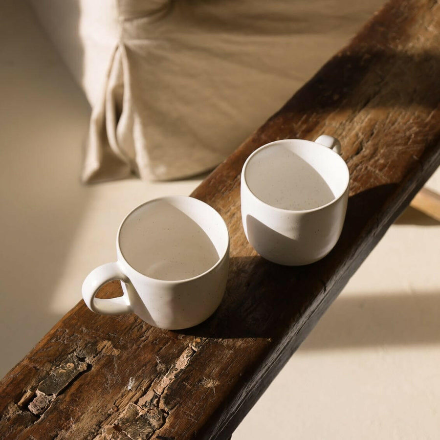 Elegant ceramic mugs perfect for hot beverages, ideal for office and home use with stylish design.