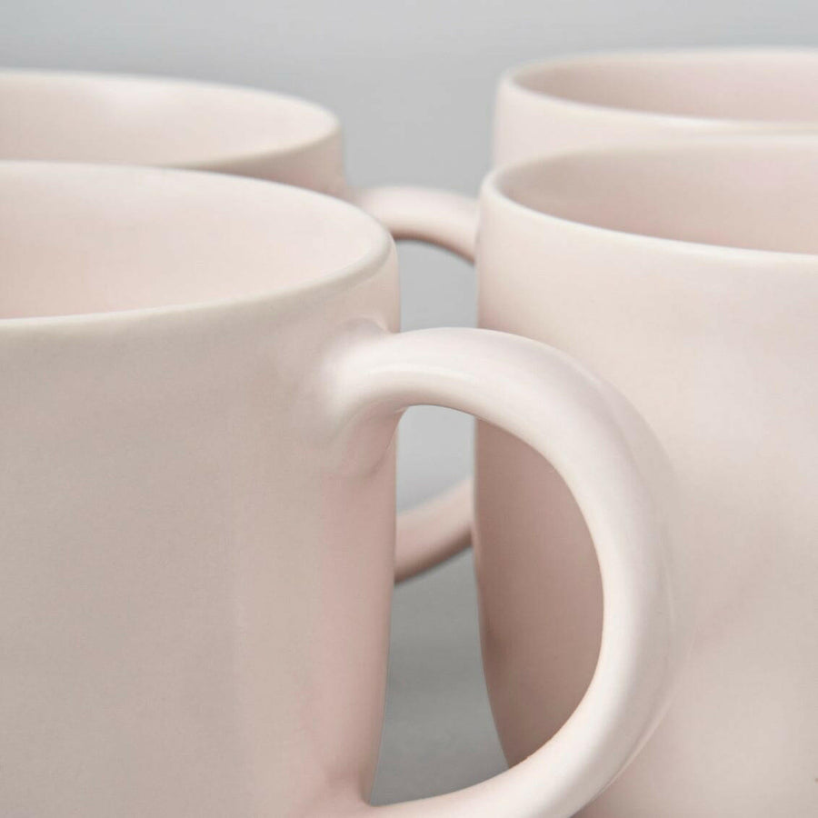 Elegant ceramic mugs perfect for hot beverages, ideal for office and home use with stylish design.