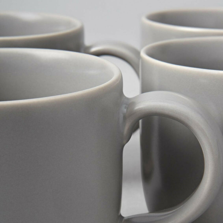 Elegant ceramic mugs perfect for hot beverages, ideal for office and home use with stylish design.