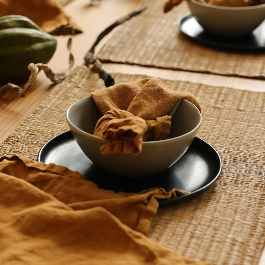 Fresh garden salad served on elegant plates, perfect for a healthy and stylish meal presentation.